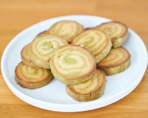 Lemon and Matcha Pinwheel Cookies on a white plate
