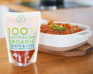 Creamy Tomato Pasta Bake witha pack of the AOFC tomato pasta sauce in front
